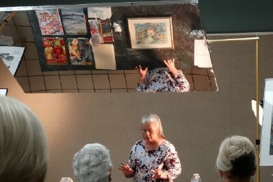 Each painting was talked about as it was placed "under the mirror" -  audience participation was welcomed.